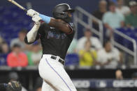 Miami Marlins' Jesus Sanchez watches his three-run home run in the third inning of the team's baseball game against the Kansas City Royals, Wednesday, June 7, 2023, in Miami. (AP Photo/Peter Joneleit)