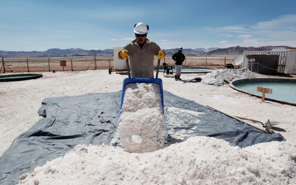 Braulio Lopez of Galaxy Resources lithium mining division carts halite concentrate at the Salar del Hombre Muerto in Salta Province