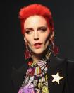 <p>Pay homage to the late David Bowie with a bright red mullet.</p>