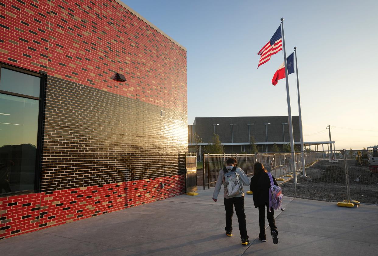 Students arrive for the first day of classes at Del Valle Middle School last August. The Del Valle district has hired a firm to search for a new superintendent.