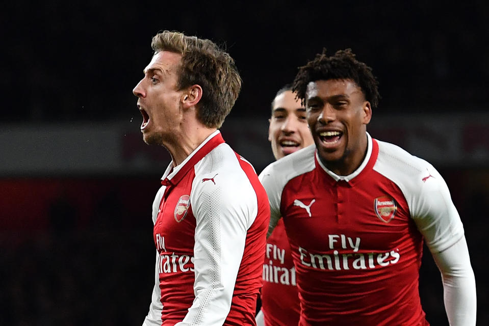 Nacho Monreal celebrates Arsenal’s first goal, which found its way into the net after deflections off of two Chelsea heads. (Getty)