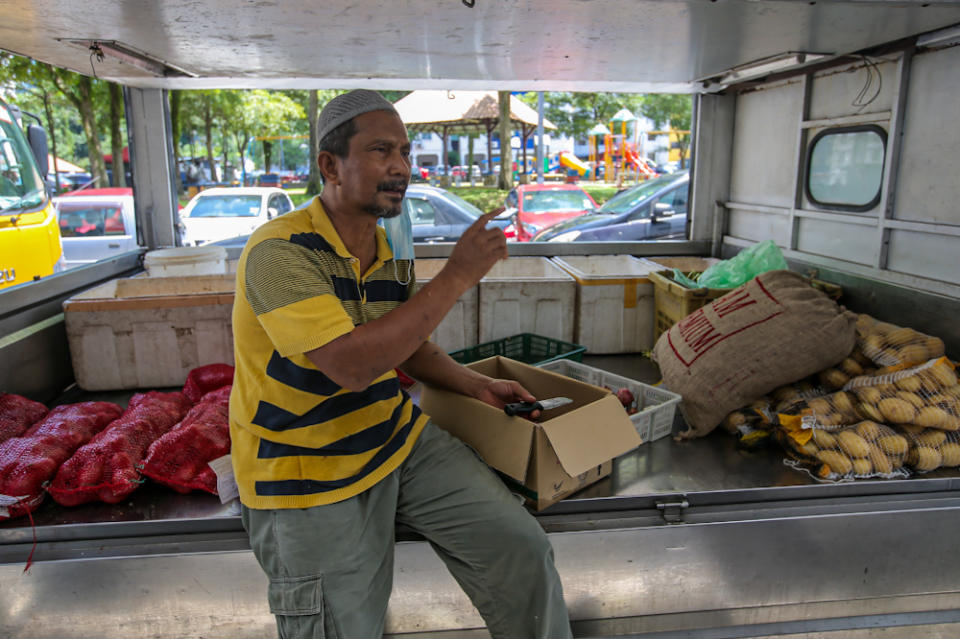 Grocer Shaari Zakaria hopes for better coordination by the police conducting roadblocks. — Picture by Hari Anggara