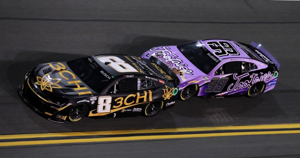 Things were going well Thursday night until one of Daniel Suarez's nudges sent race leader Kyle Busch (8) into the outside wall.