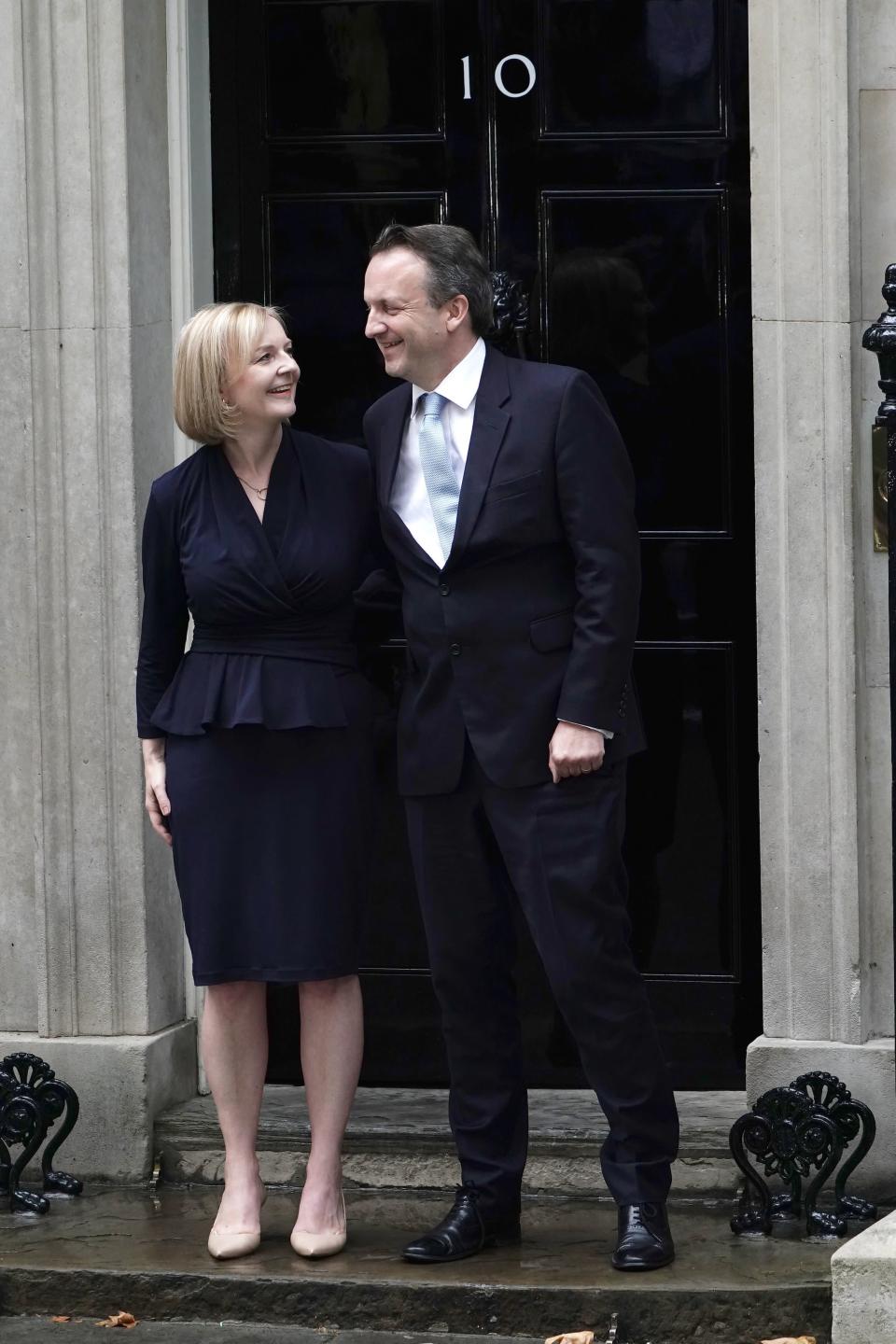 New Prime Minister Liz Truss and her husband Hugh O'Leary pose outside 10 Downing Street (PA)