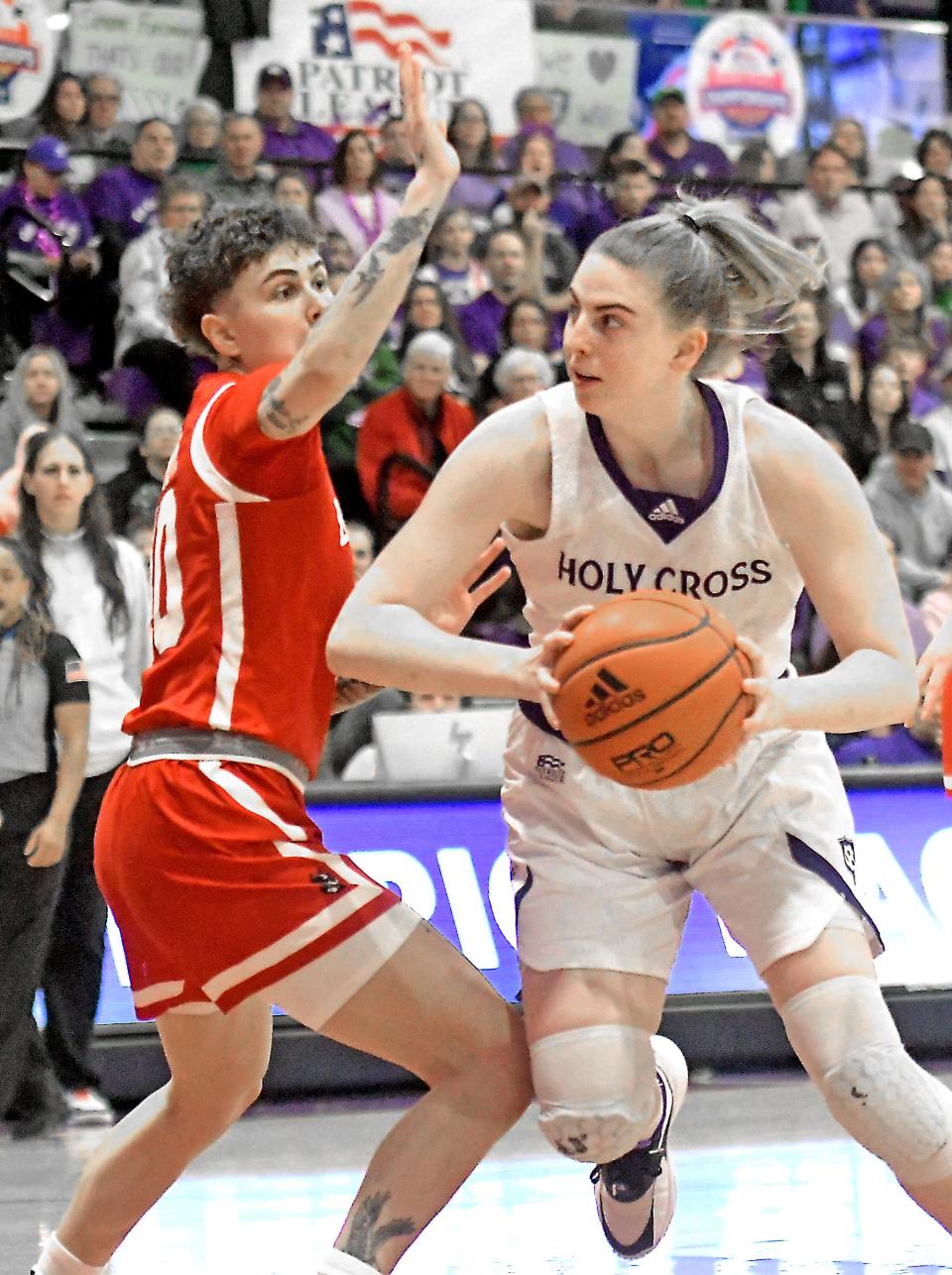 Holy Cross' Bronagh Power-Cassidy makes a move toward the basket on Boston University's Sophie Beneventine.