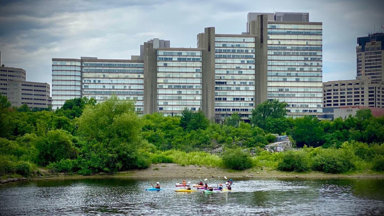 Several of the Place du Portage III buildings in Gatineau, Que., are seen in this photo from 2021. Two of the towers were closed Thursday after asbestos was possibly disturbed during work the night before. (Christian Patry/CBC - image credit)