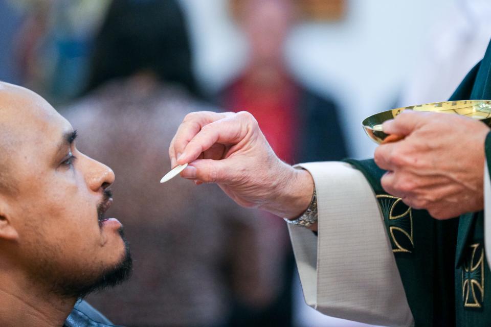 Archbishop Paul S. Coakley celebrates the Eucharist on Feb. 11 during the last Mass at Holy Angels Church in Oklahoma City.