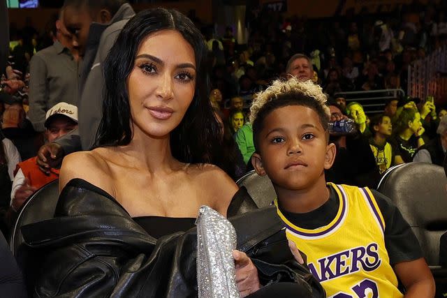 <p>Jim Poorten/NBAE via Getty</p> Kim Kardashian and Saint at an LA Lakers game in 2023