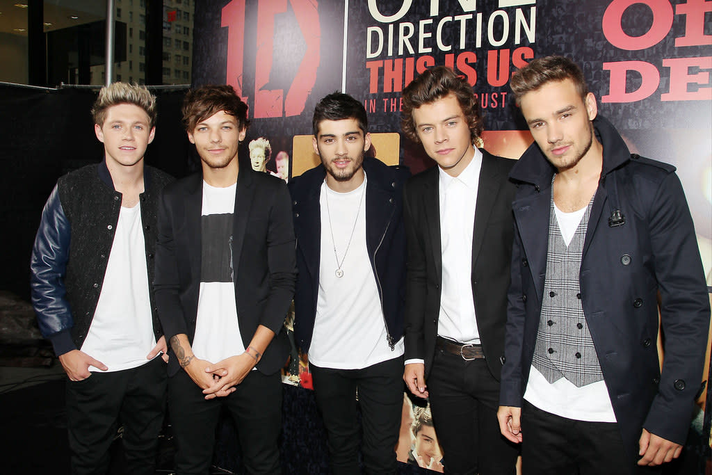 members of One Direction, from left, Niall Horan, Louis Tomlinson, Zayn Malik, Harry Styles, and Liam Payne at the  premiere of the film "One Direction:This Is Us," at the Ziegfeld Theatre in New York on Monday, Aug. 26, 2013.