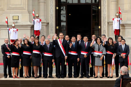 Peru's President Martin Vizcarra and new ministers pose for a picture during the swearing-in ceremony at the government palace in Lima, Peru, April 2, 2018. REUTERS/Guadalupe Pardo