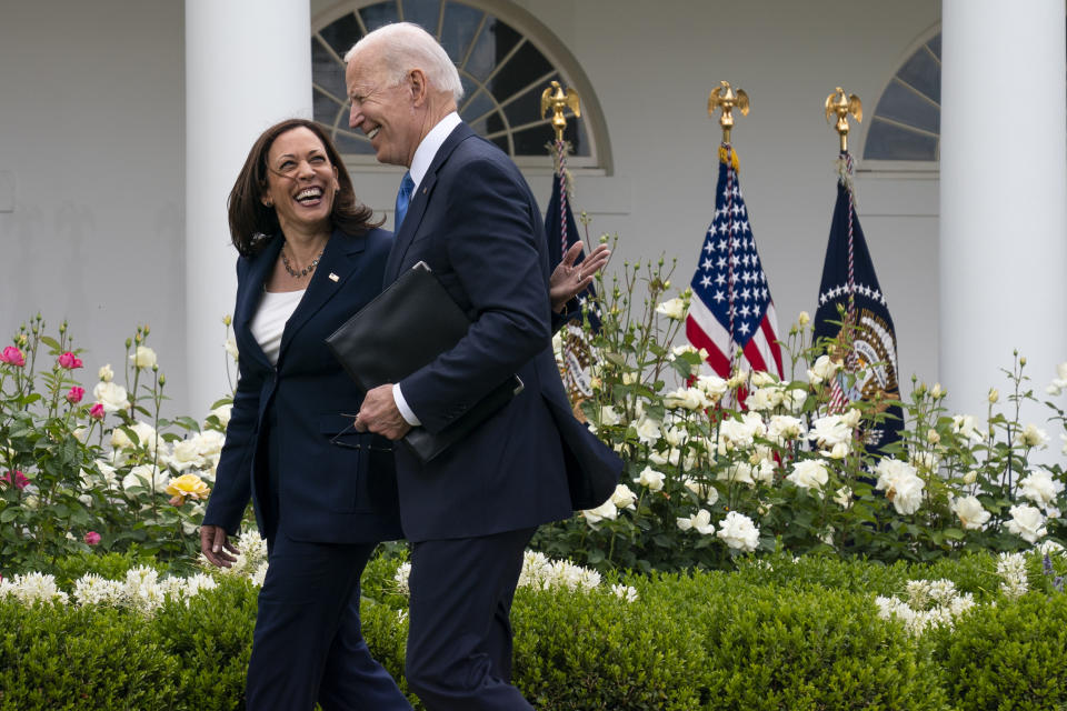 Vice President Kamala Harris and President Joe Biden smile and walk off after speaking about updated guidance on mask mandates, in the Rose Garden of the White House, Thursday, May 13, 2021, in Washington. (AP Photo/Evan Vucci)