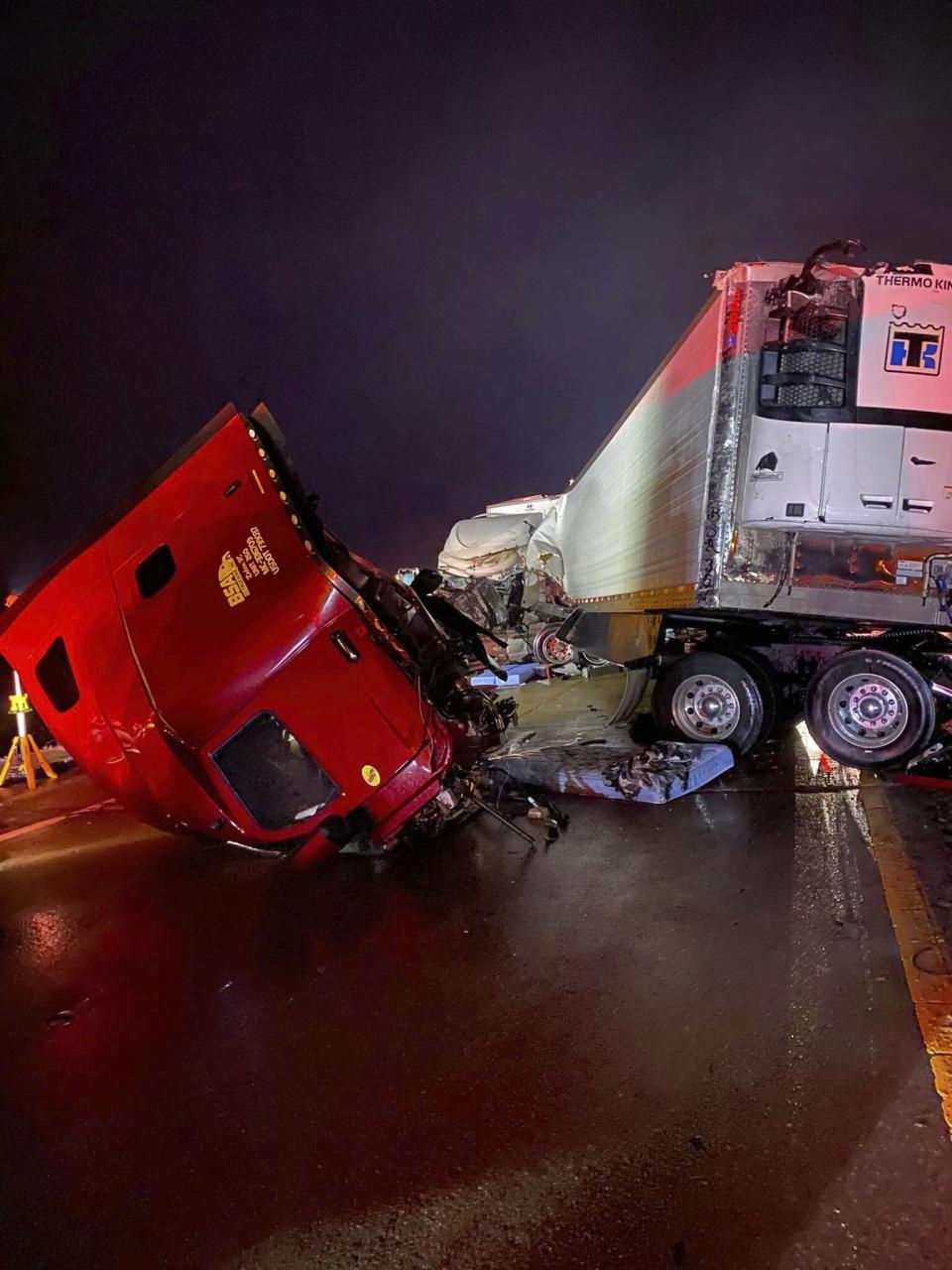 This photo provided by the Forrest City, Ark., Fire Department shows an overturned tractor trailer on Interstate 40, at mile marker 254, about 13 miles from the Forrest City exit on Tuesday morning, Jan. 31, 2023. (Forrest City Fire Department via AP)