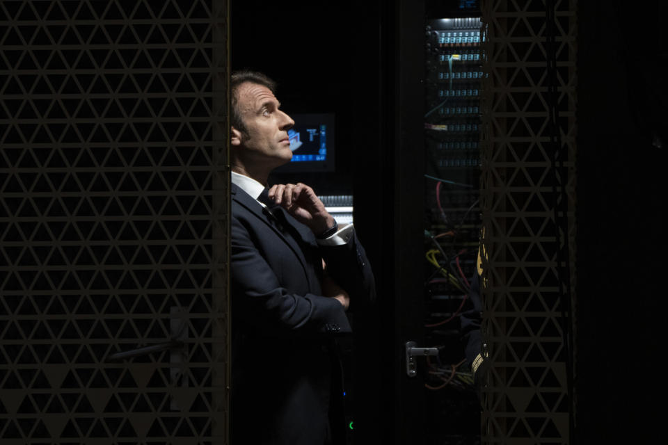 French President Emmanuel Macron waits to go on stage to explain his vision on the future of Europe during a lecture in a theatre in The Hague, Netherlands, Tuesday, April 11, 2023. (AP Photo/Peter Dejong)