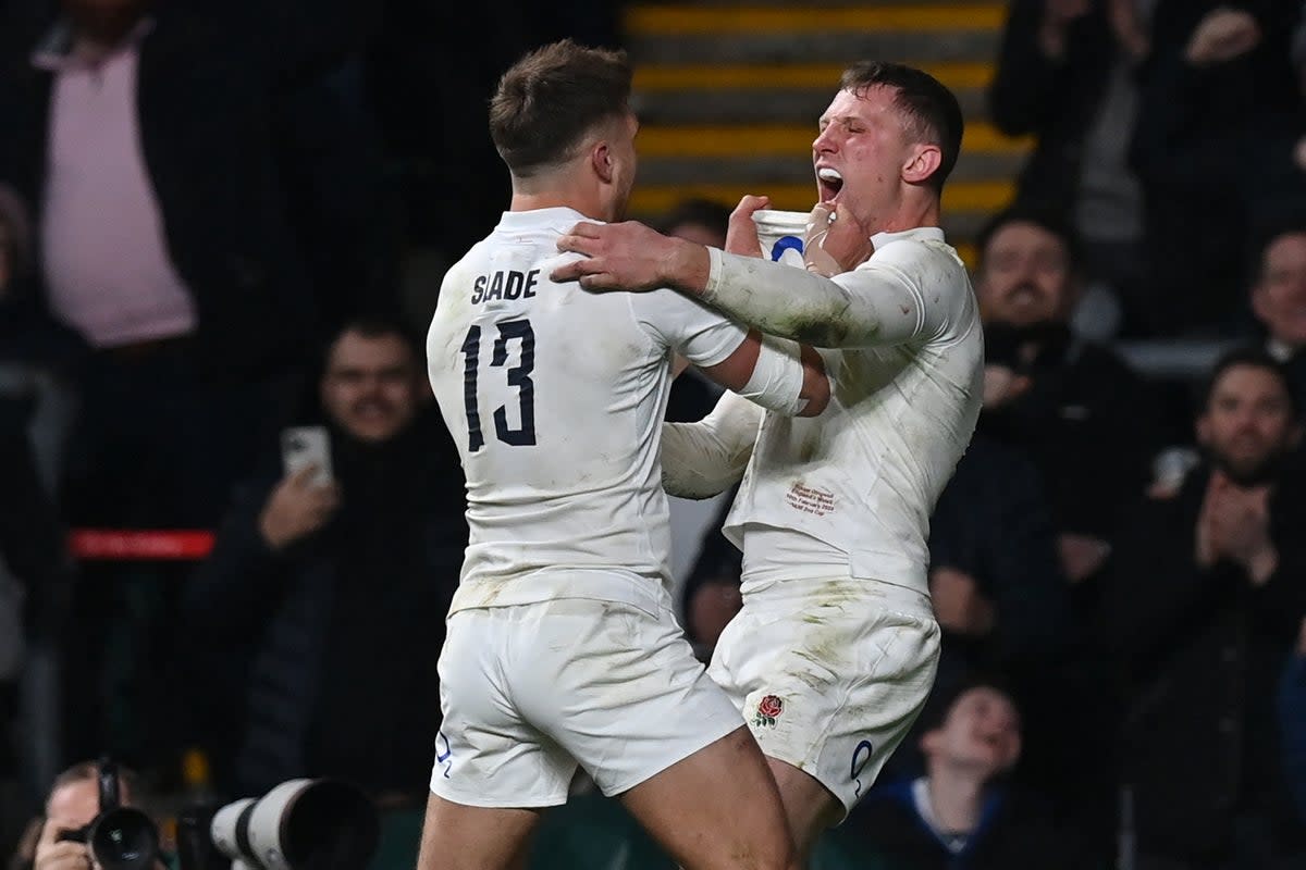 Fraser Dingwall (right) celebrates with Henry Slade after scoring England’s second try as the home side snatched victory at Twickenham  (AFP/Getty)
