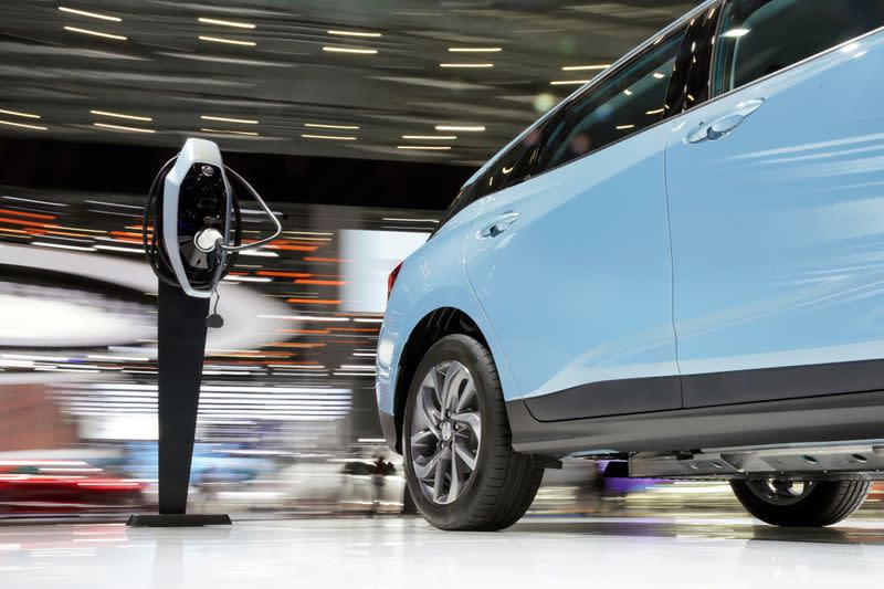 FILE PHOTO: Charging station for Buick's electric vehicles(EV) is seen next to the new Velite 6 during the media day for Shanghai auto show