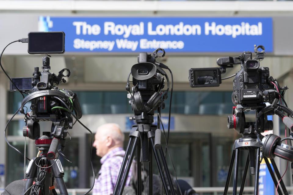 FILE - Journalists' cameras are lined up at the entrance to The Royal London Hospital in London, Friday, Aug. 5, 2022. The family of 12-year-old Archie Battersbee who has been in a coma for four months expects a London hospital to begin withdrawing life-sustaining treatment Saturday after his parents exhausted their legal options in a battle over his care. (AP Photo/Frank Augstein, File)