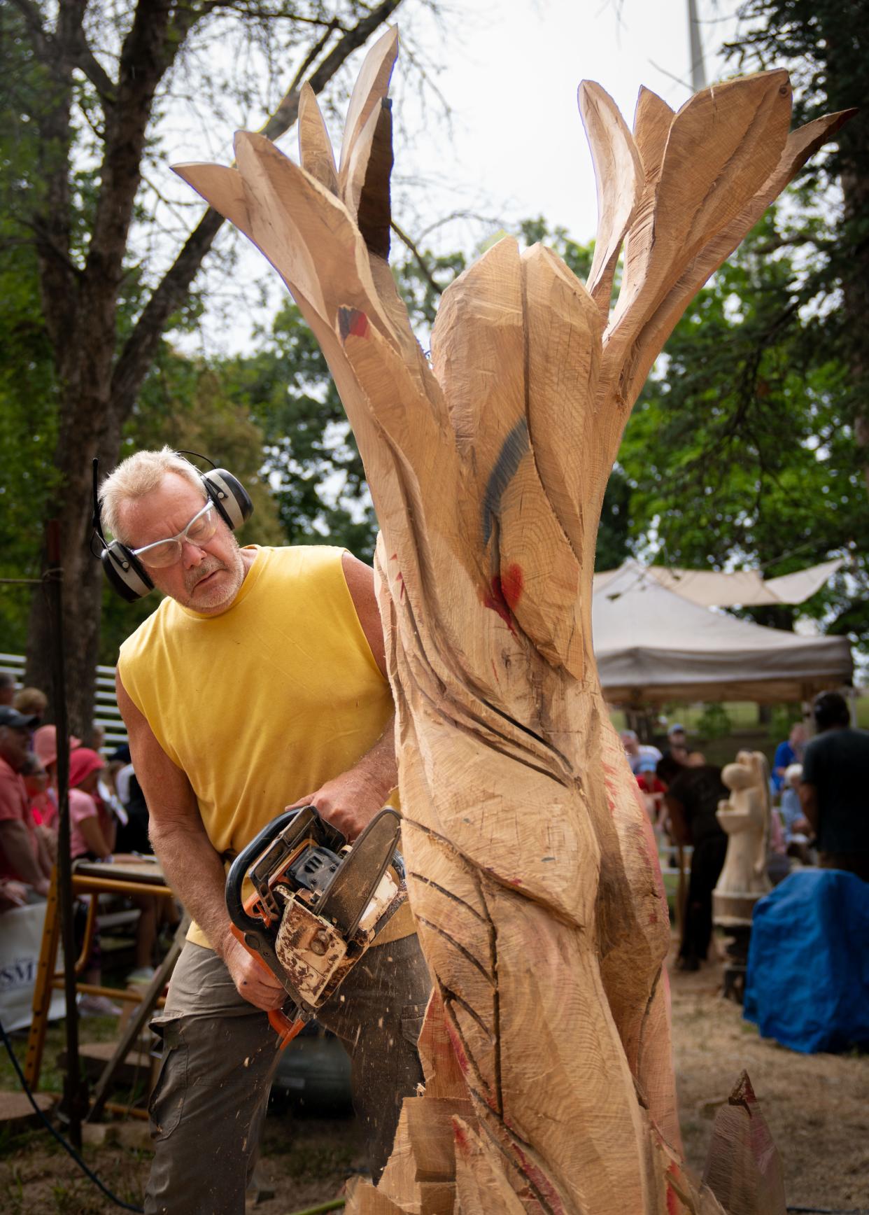 Gary Keenan carves a statue at the Iowa State Fair.