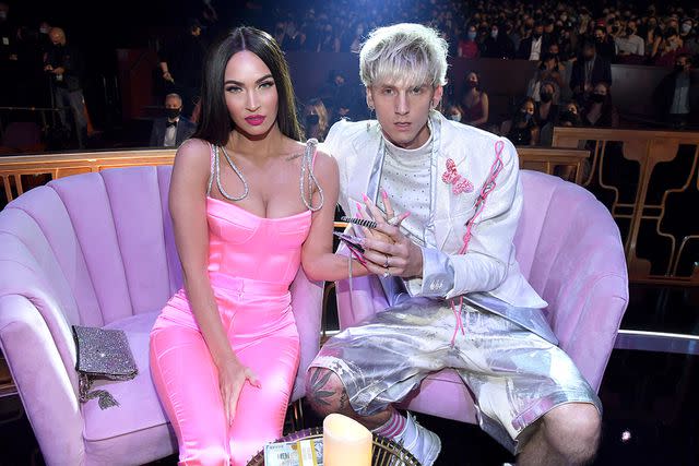 <p>Kevin Mazur/Getty</p> Megan Fox and Machine Gun Kelly attend the 2021 iHeartRadio Music Awards