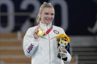 Jade Carey, of the United States, poses after winning the gold medal for the floor exercise during the artistic gymnastics women's apparatus final at the 2020 Summer Olympics, Monday, Aug. 2, 2021, in Tokyo, Japan. (AP Photo/Ashley Landis)