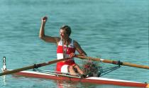 (BAR 10) BANYOLES, Aug.2--SIGNALS VICTORY--Canadian rower Silken Laumann raises her arm in gesture as she leaves the winners area with her gold medal for the Olympic women's single scull competition in Banyoles Sunday. (CP PHOTO) 1992 (stf-Ron Poling)