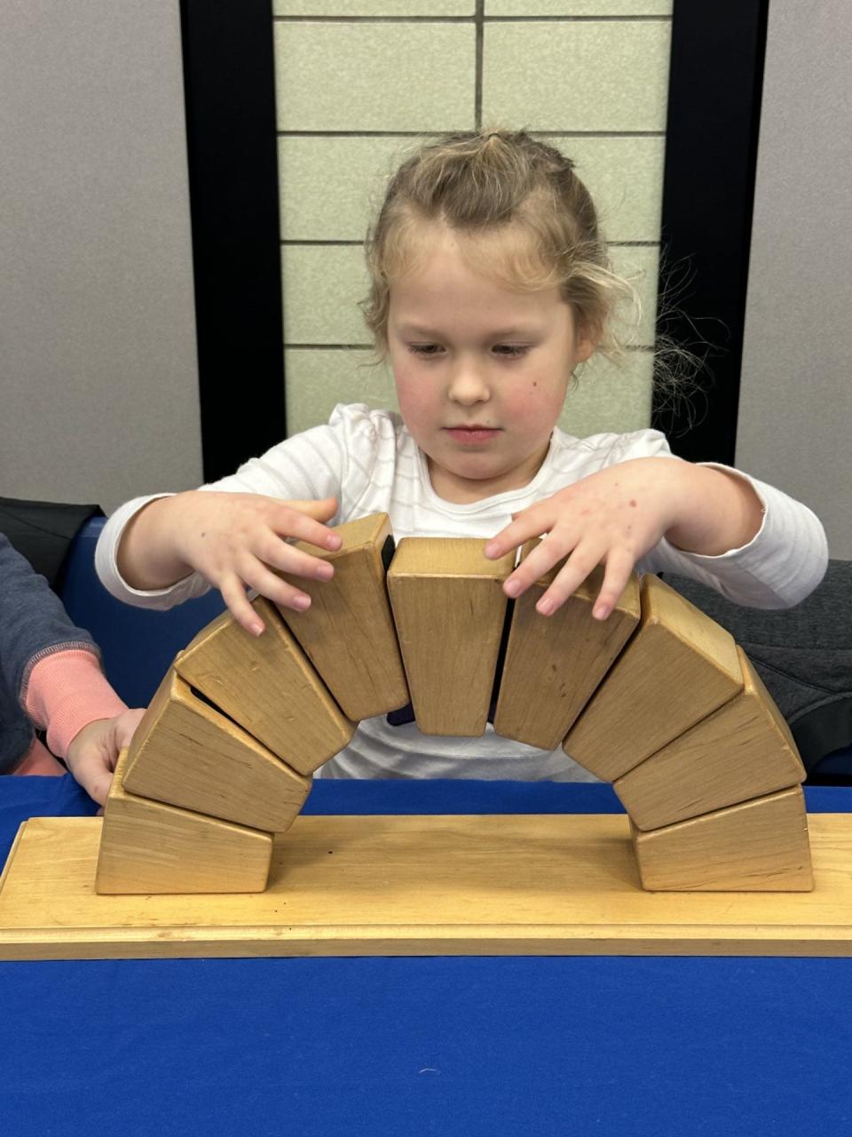 Eyler Elementary School student Adelynn Harmon builds a structure during a recent Imagination Station event at the school.