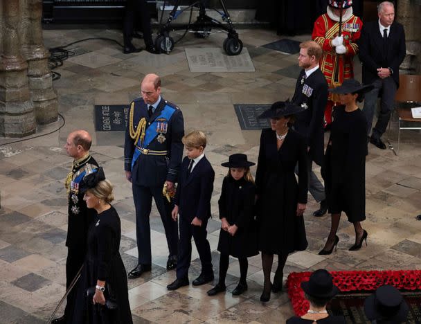 PHOTO: Prince William, Kate, Princess of Wales, Prince Harry, Meghan, Duchess of Sussex, Prince George and Princess Charlotte arrive for the funeral of Britain's Queen Elizabeth II, in London, Sept. 19, 2022. (Phil Noble/AP)