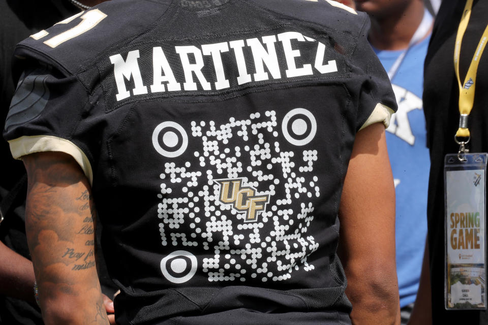 ORLANDO, FL - APRIL 16: UCF Knights defensive back Nikai Martinez #21 walks the sideline during the UCF Spring Game at the Bounce House on April 16, 2022 in Orlando, Florida. The players are wearing QR codes on their jerseys instead of traditional numbers which will send viewers to the players' backgrounds online, merchandise stores, social media accounts and charities of choice. (Photo by Alex Menendez/Getty Images)