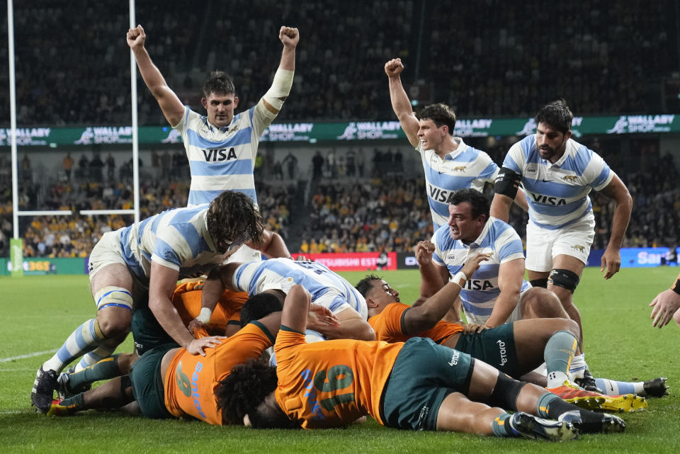 Argentinian players celebrate a try by teammate Juan Martin Gonzalez during the Rugby Championship test match between Australia and Argentina in Sydney, Australia, Saturday, July 15, 2023. (AP Photo/Rick Rycroft)