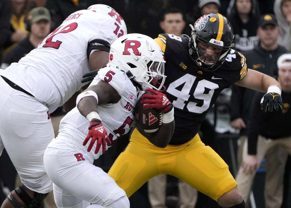 Rutgers running back Kyle Monangai (5) runs the ball during the first half of an NCAA college football game against Iowa, Saturday, Nov. 11, 2023, in Iowa City, Iowa. (AP Photo/Bryon Houlgrave)