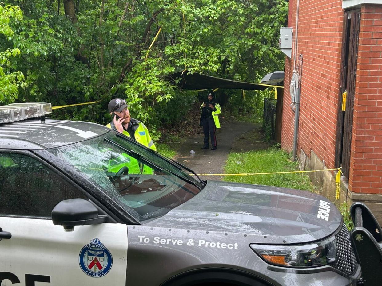 Toronto police at the scene of a fatal overnight shooting in Scarborough. (Ken Townsend/CBC - image credit)