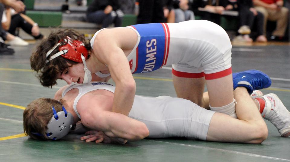 West Holmes's Brady Smith defeats Harrison Central Justin Sampson 19-4 in the final at 106 pounds.