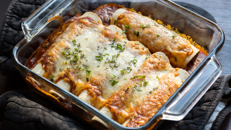 Enchiladas with sauce and cheese