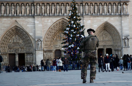 French soldiers patrol near the Notre-Dame Cathedral in Paris, France, December 13, 2018. REUTERS/Gonzalo Fuentes