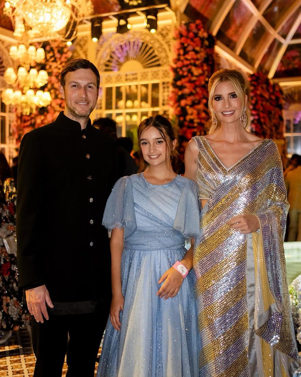 Ivanka Trump (R) in a Manish Malhotra sari, with husband Jared Kushner (L) and daughter Arabella at the three-day pre-wedding celebrations on March 1, 2024.