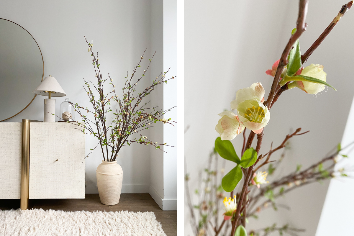 a white vase with flowers