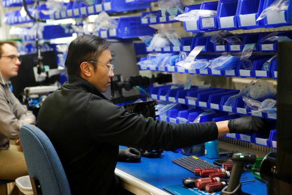 An employee works on final assembly of VOCSN Multi-Function Ventilators, which integrate five separate medical devices, at Ventec Life Systems, a ventilator manufacturer that has seen a large increase in demand since the global coronavirus disease (COVID-19) outbreak began, in Bothell, Washington, U.S. March 18, 2020.  REUTERS/Lindsey Wasson