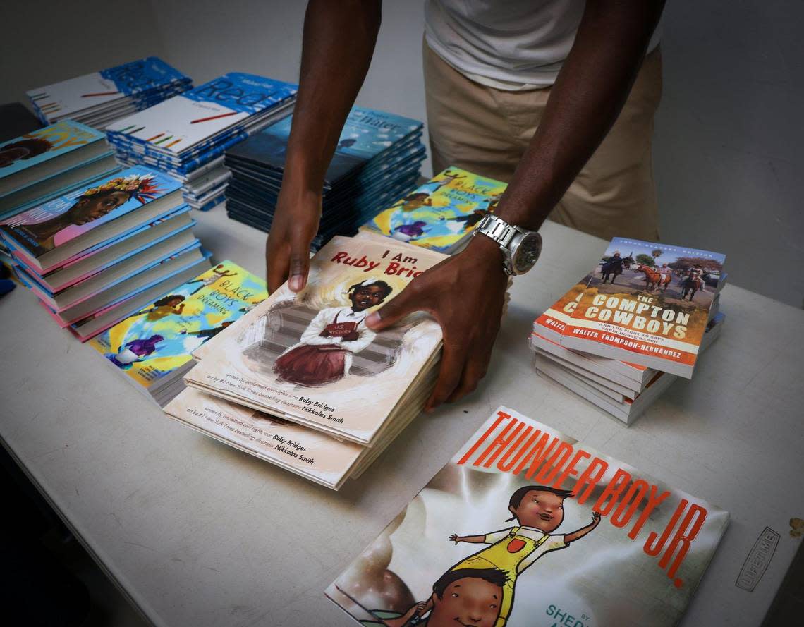 Chicago resident and TJC Freedom Rider, Edward Ward, distributes banned books at Mt. Olive Missionary Baptist Church, where national and local activists gathered to confront the anti-woke agenda by Florida governor and presidential candidate, Ron DeSantis on Thursday, June 22, 2023.