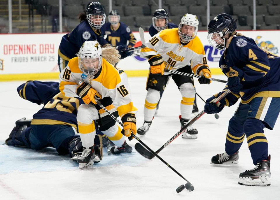 Adrian College's Une Bjelland takes a shot during Saturday's game at the Huntington Center in Toledo against Trine.