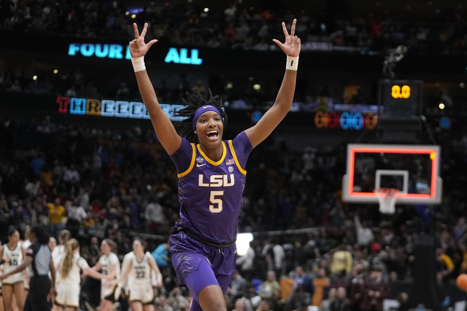 LSU's Sa'Myah Smith reacts to a three pointer during the first half of the NCAA Women's Final Four championship basketball game against Iowa Sunday, April 2, 2023, in Dallas. (AP Photo/Darron Cummings)