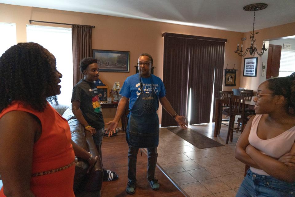 James Melton, 53, talks to his family in between making dinner Tuesday, June 14, 2022, at his home in Indianapolis.