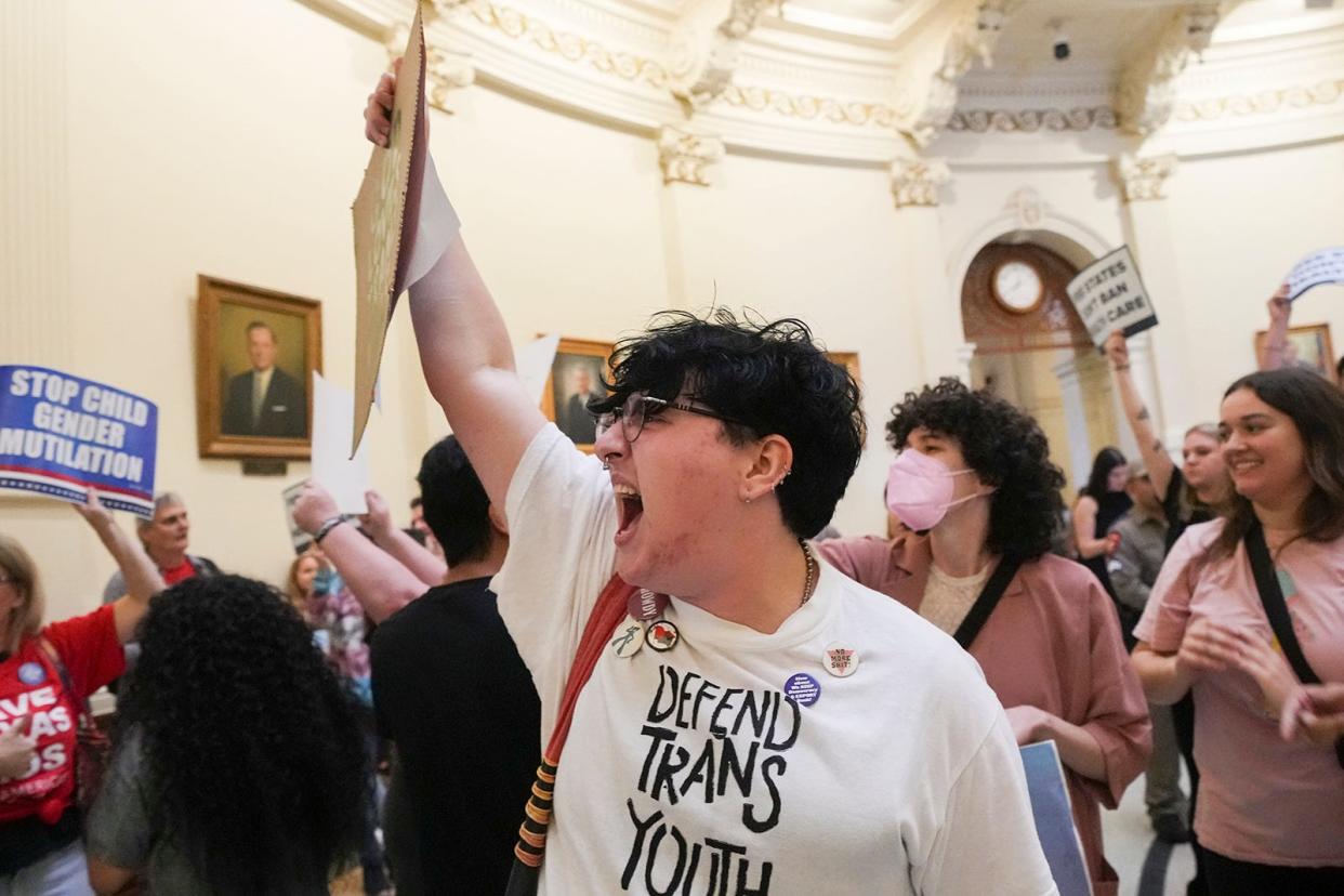 Harlan Carroll cheers as LGBTQ rights activists protest SB14 at the Capitol of Texas Tuesday, May 2, 2023. SB14 would ban gender-affirming medical care for transgender children