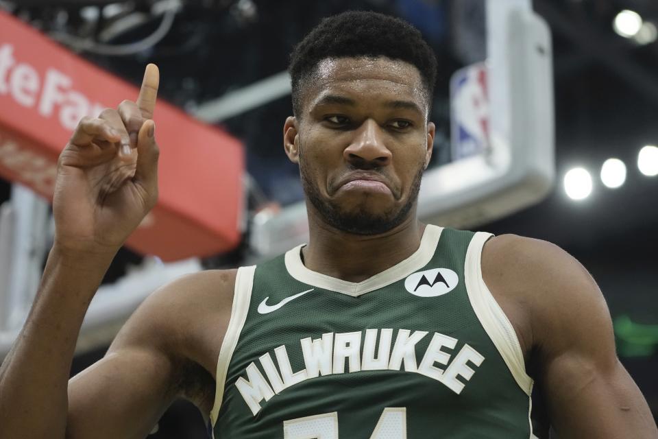 Milwaukee Bucks' Giannis Antetokounmpo reacts after being fouled during the first half of an NBA basketball game Monday, Dec. 11, 2023, in Milwaukee. (AP Photo/Morry Gash)