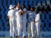 Cricket - New Zealand v South Africa - second cricket test match - Centurion Park, Centurion, South Africa - 30/8/2016. South Africa's Kagiso Rabada (C) is congratulated by his teammates after he bowled out New Zealand's Tim Southee. REUTERS/Siphiwe Sibeko