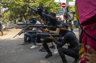 FILE - In this April 3, 2021, file photo, anti-coup protesters line in formation with homemade air rifles during a demonstration against the military coup in Yangon, Myanmar. The situation in Myanmar after the army’s seizure of power eight months ago has long since become an extended bloody conflict with ever-escalating violence, and popular resistance to February’s military takeover appears to be surging into all-out armed conflict. (AP Photo/File)