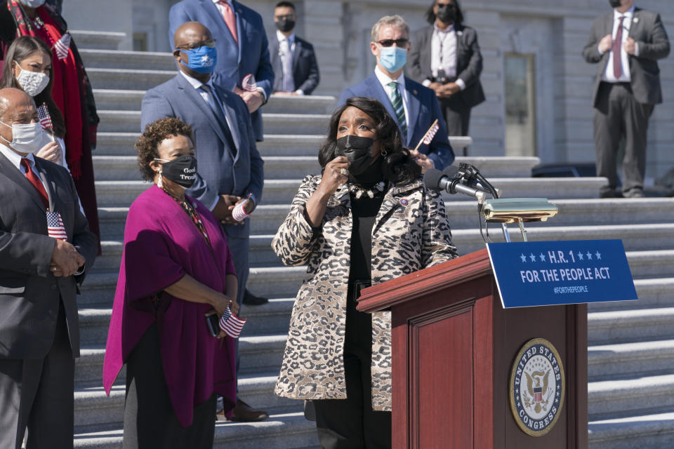 Rep. Terri Sewell, D-Ala., recalls the work of the late Rep. John Lewis as Democrats gather to address reporters on H.R. 1, the For the People Act of 2021, at the Capitol in Washington, Wednesday, March 3, 2021. House Democrats are poised to pass a sweeping elections and ethics bill, offering it up as a powerful counterweight to voting rights restrictions advancing in Republican-controlled statehouses. (AP Photo/J. Scott Applewhite)