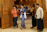 FILE PHOTO: National League for Democracy party (NLD) leader Aung San Suu Kyi and Member of Parliament Thaw leave after attending a lower house of parliament meeting at Naypyitaw