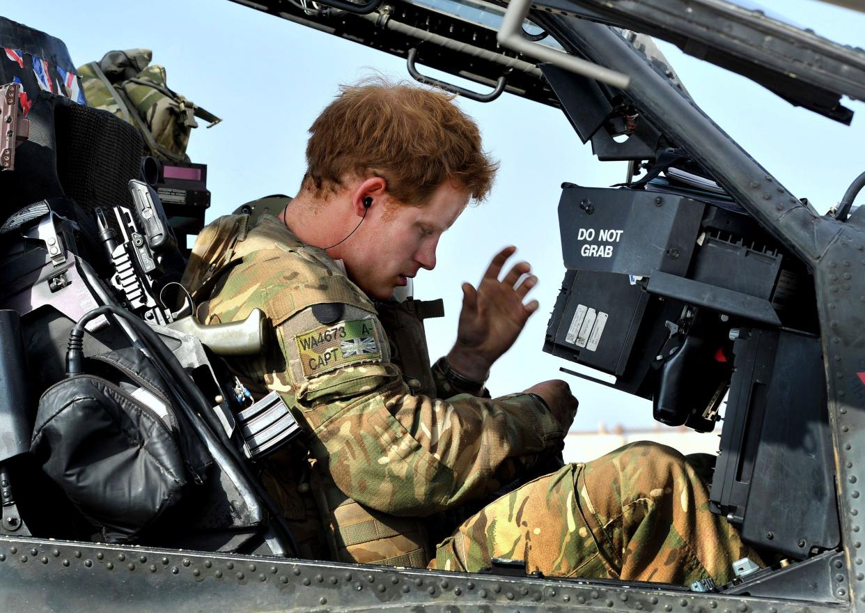 Britain's Prince Harry sits in the cockpit of an Apache helicopter in Camp Bastion, southern Afghanistan in this photograph taken October 31, 2012, and released January 21, 2013. The Prince, who is serving as a pilot/gunner with 662 Squadron Army Air Corps, is on a posting to Afghanistan that runs from September 2012  to January 2013.  Photograph taken October 31, 2012.     REUTERS/John Stillwell/Pool  (AFGHANISTAN - Tags: MILITARY POLITICS SOCIETY ROYALS CONFLICT)