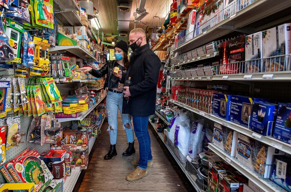 Staying over for the weekend in Bucks County, Holly Eubanks, left, and Tom Consalo, of Vineland, look over the vintage toys for stocking stuffers, at Newtown Hardware House on Small Business Saturday in 2020