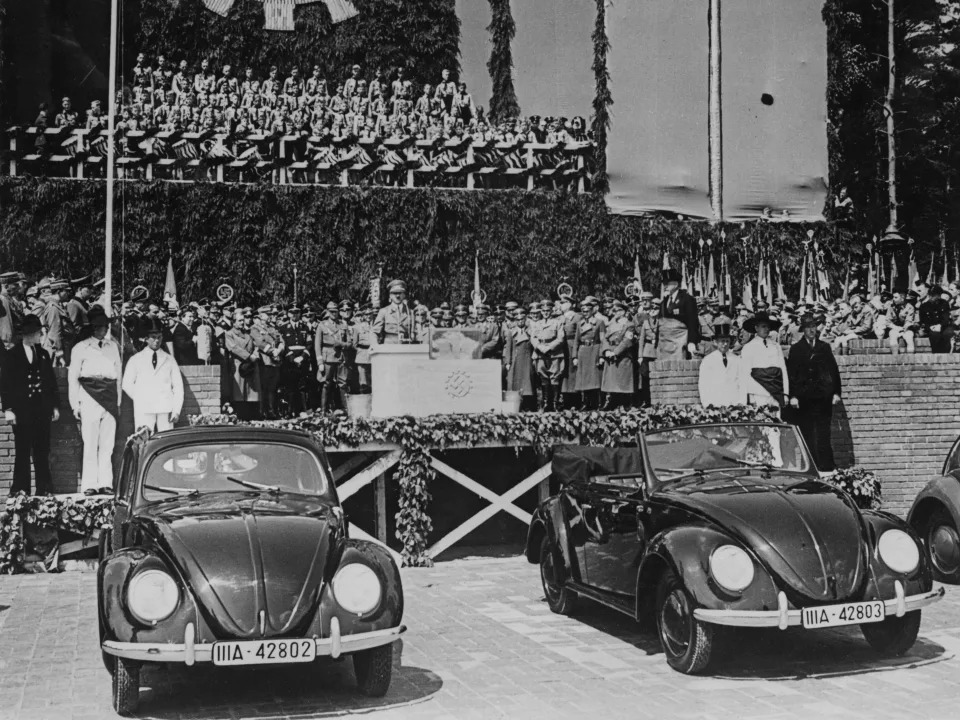 Adolf Hitler (1889 - 1945) gives a speech after laying the foundation stone of the new Volkswagen works at Fallersleben, 27th May 1938.