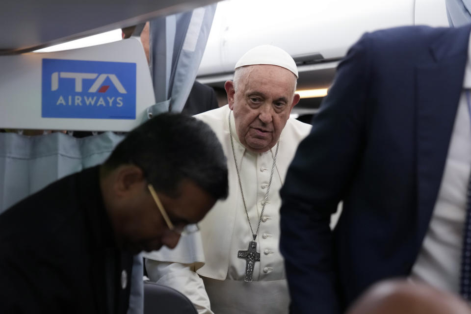 Pope Francis arrives for a press conference on board an airplane on his flight back from Marseille to Rome, Saturday, Sept. 23, 2023. Francis just ended a two-day visit to Marseille where he joined Catholic bishops from the Mediterranean region on discussions largely focused on migration. (AP Photo/Alessandra Tarantino, Pool)